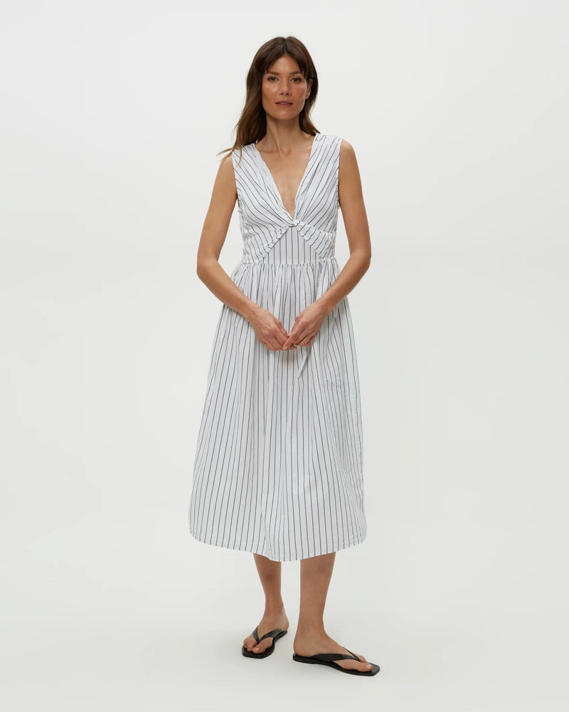 Model wearing navy stripe Michael Stars Penelope Twist Front Midi against plain backdrop