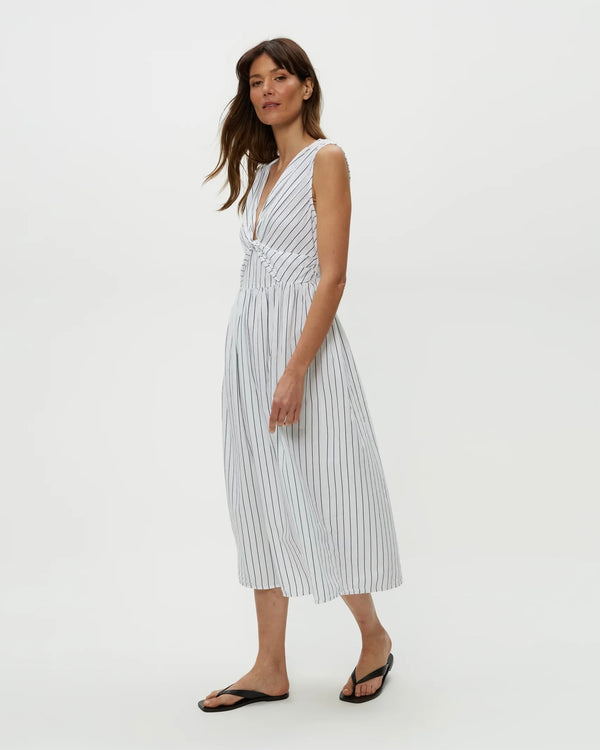 Model wearing navy stripe Michael Stars Penelope Twist Front Midi against plain backdrop